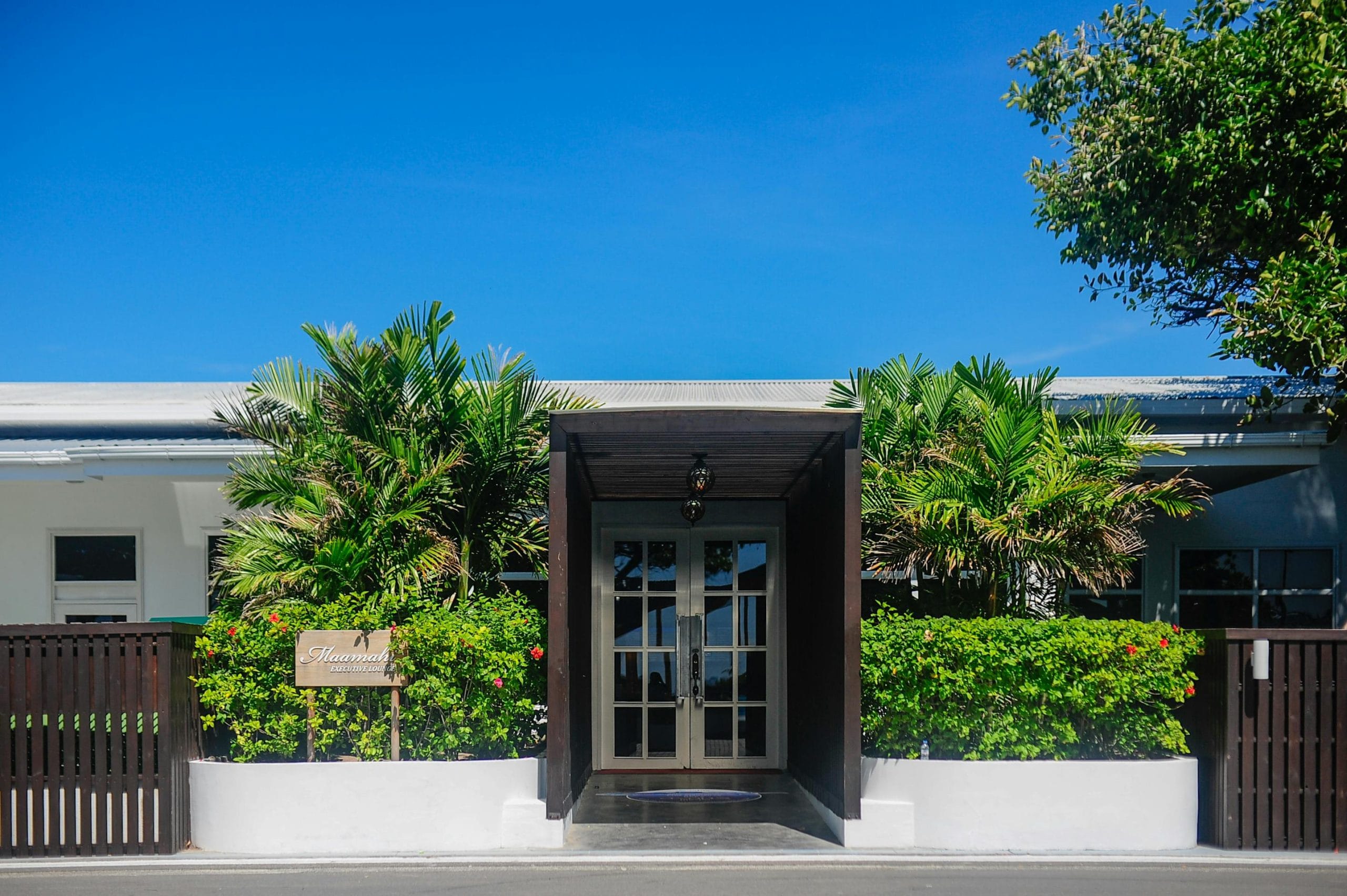 A serene example of luxury design tropical retreats featuring modern architecture by the ocean