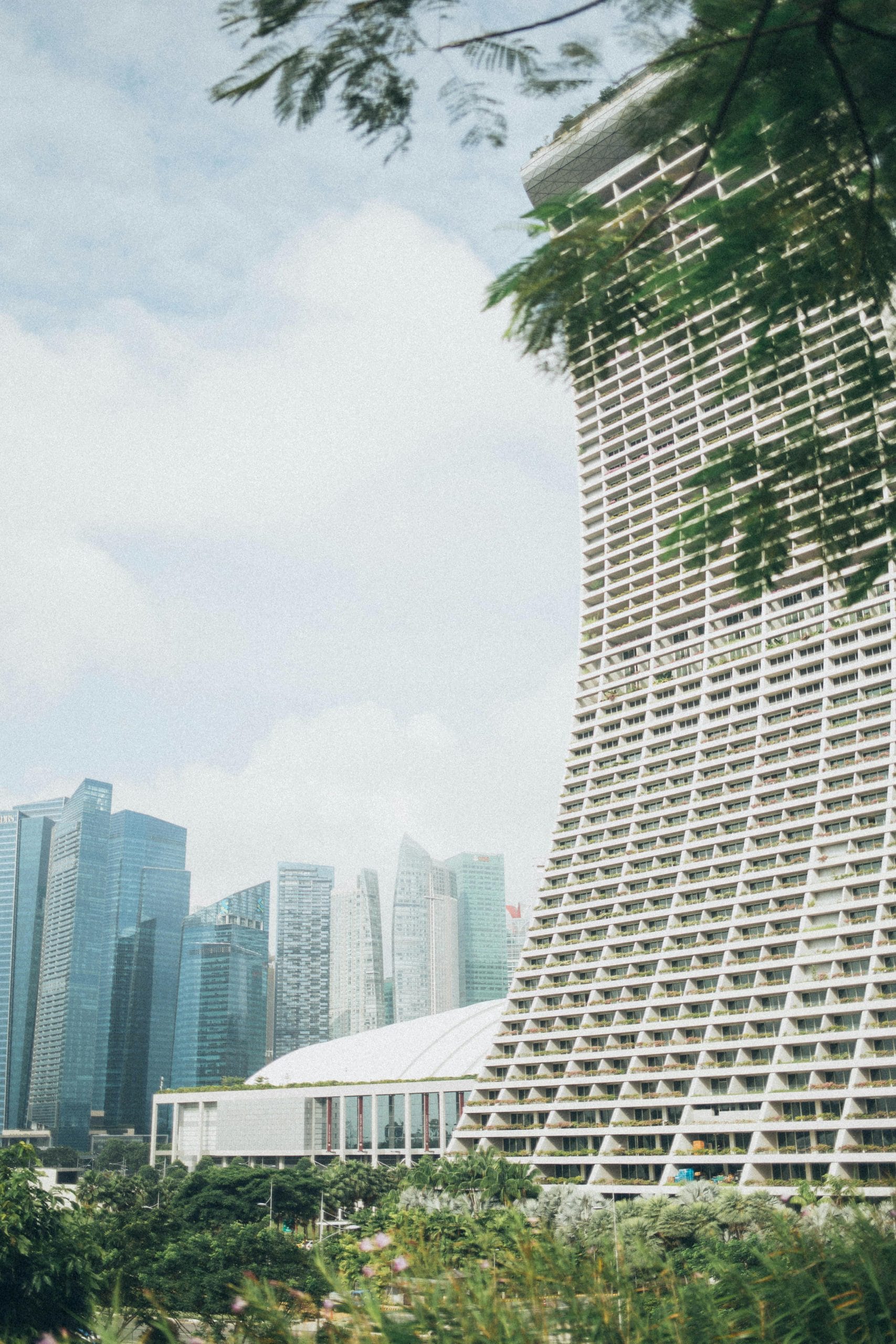 The Most Exclusive Luxury Hotels Singapore Has to Offer Aerial view of luxury hotels and the iconic Singapore skyline