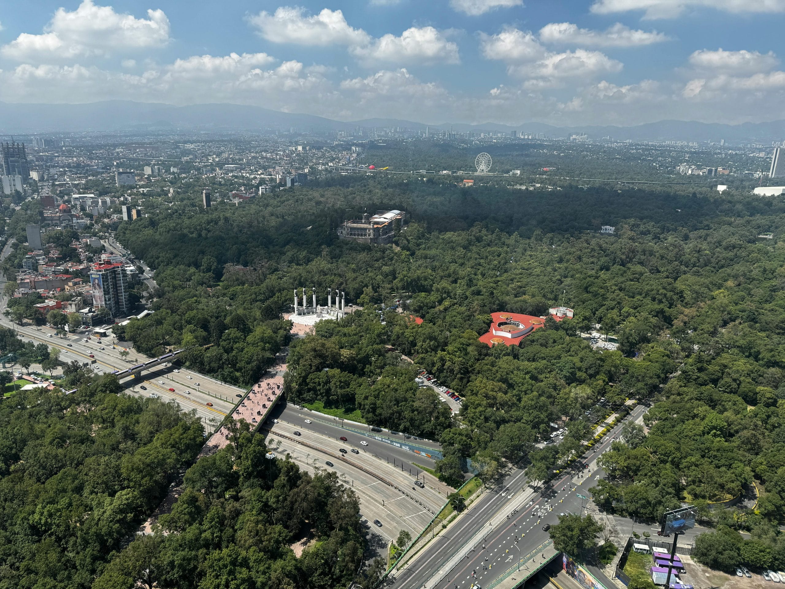 A view of Mexico City stylish neighborhoods with historic architecture and lush trees