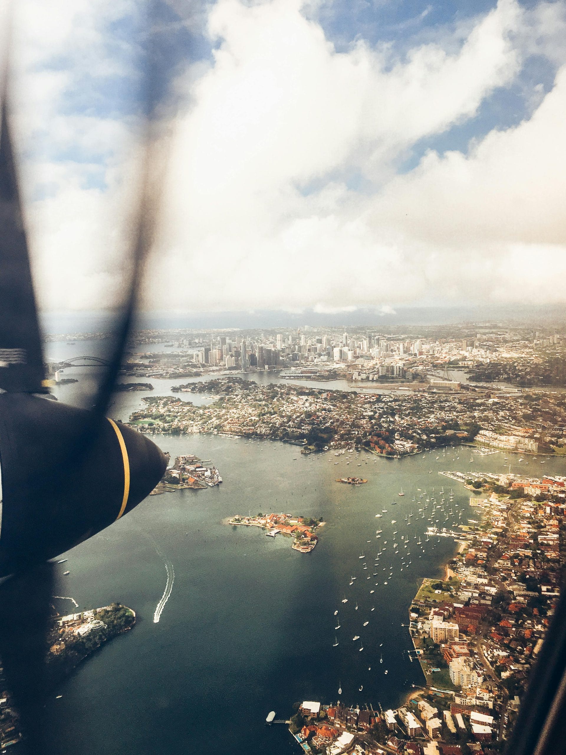 An elegant balcony overlooking Sydney harbor-view luxury hotels and the Opera House.
