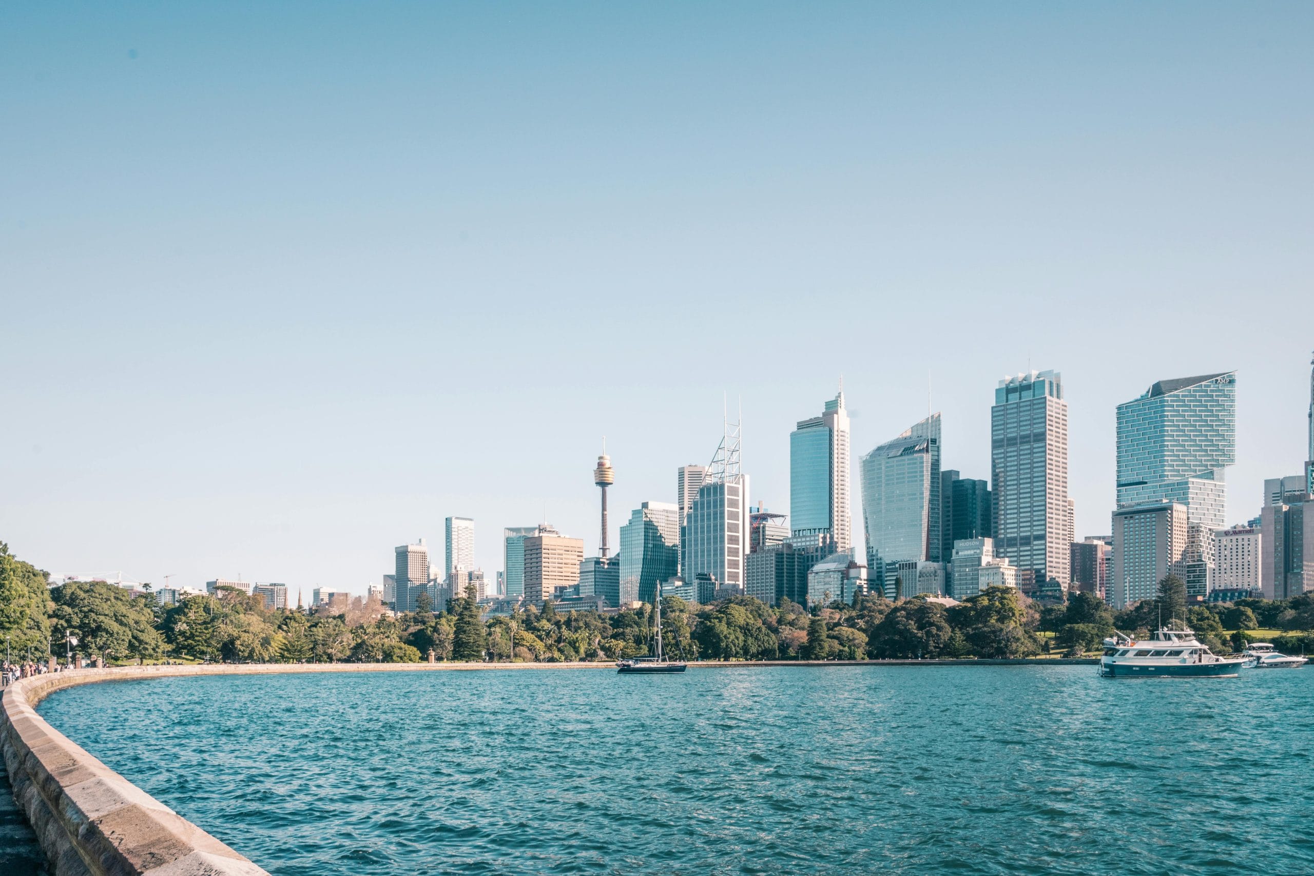 An elegant balcony overlooking Sydney harbor-view luxury hotels and the Opera House.
