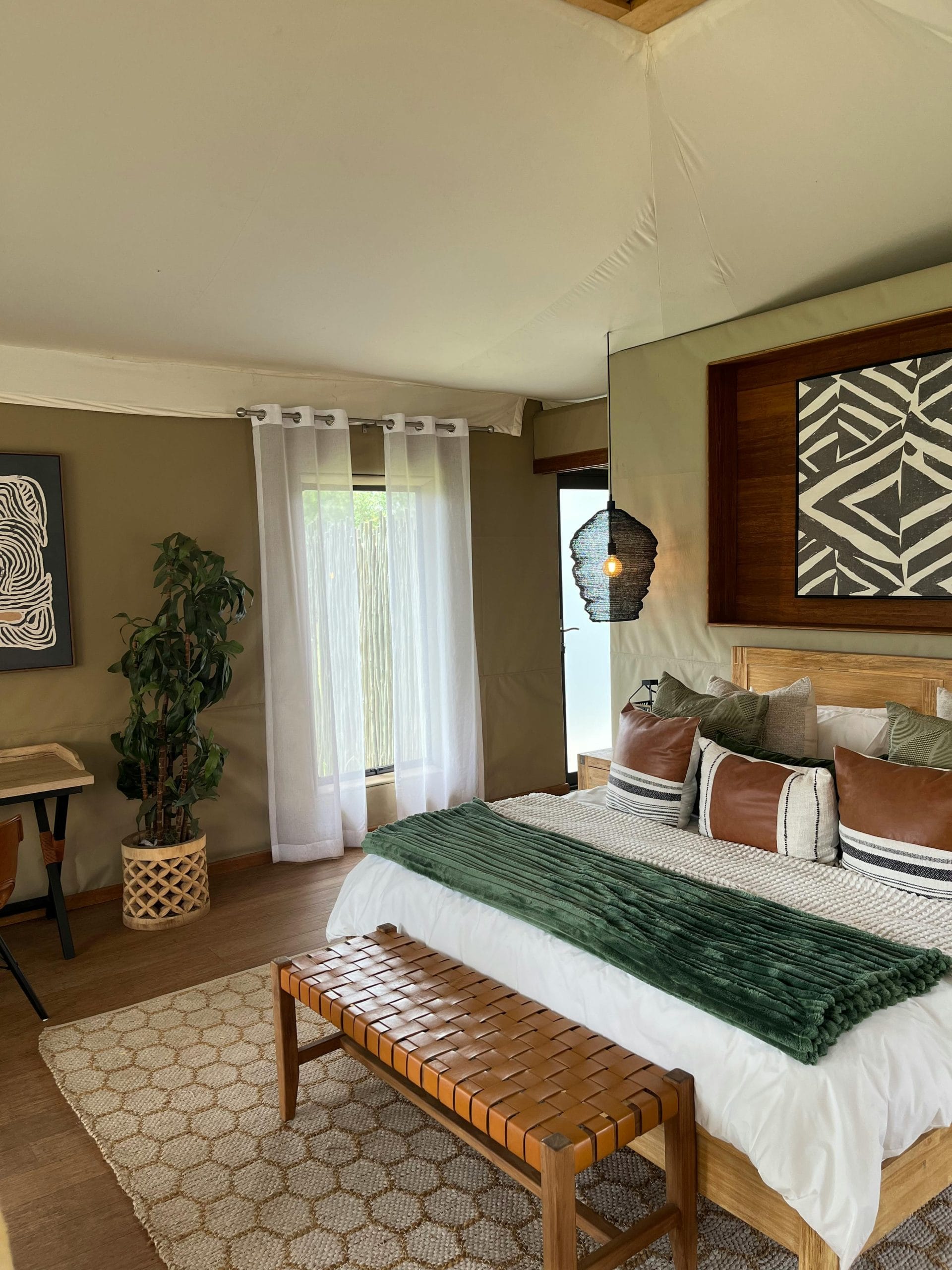 Architectural luxury safari lodges in the African wilderness at dawn