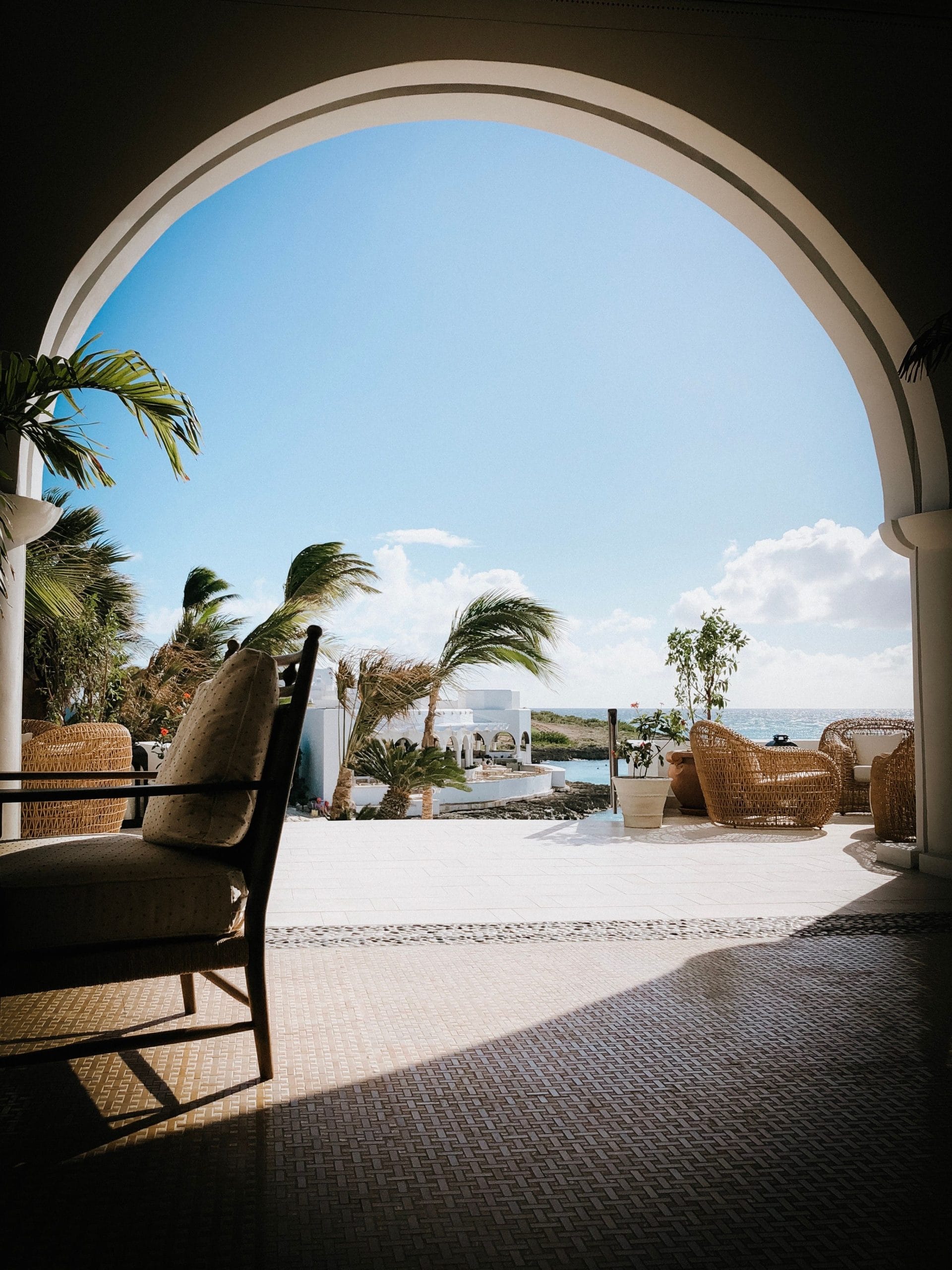 Caribbean Quiet Luxury Escapes for the Refined Traveler A serene terrace overlooking the ocean in one of the many Caribbean quiet luxury escapes