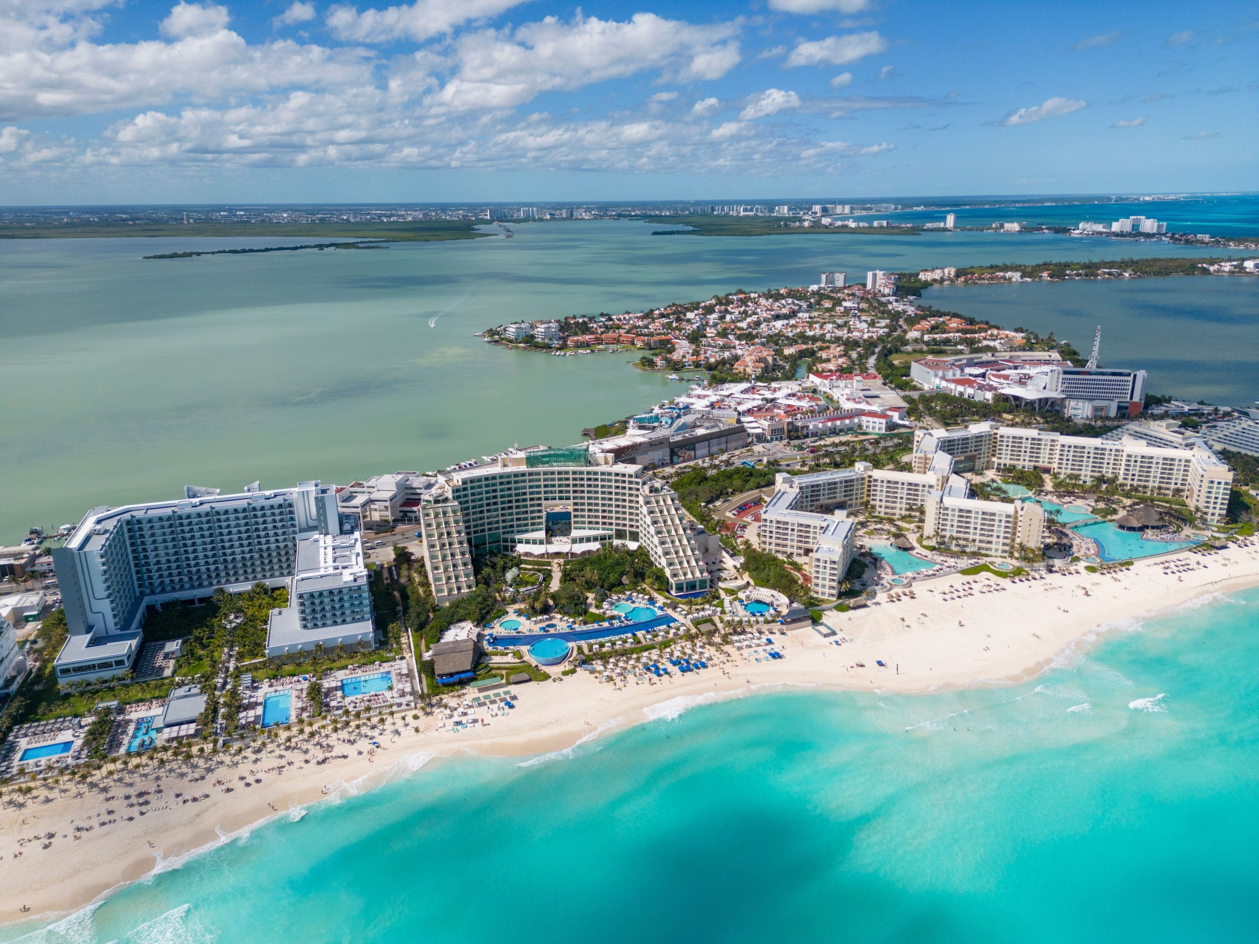 A serene view of luxury adult-only beach resorts at sunset