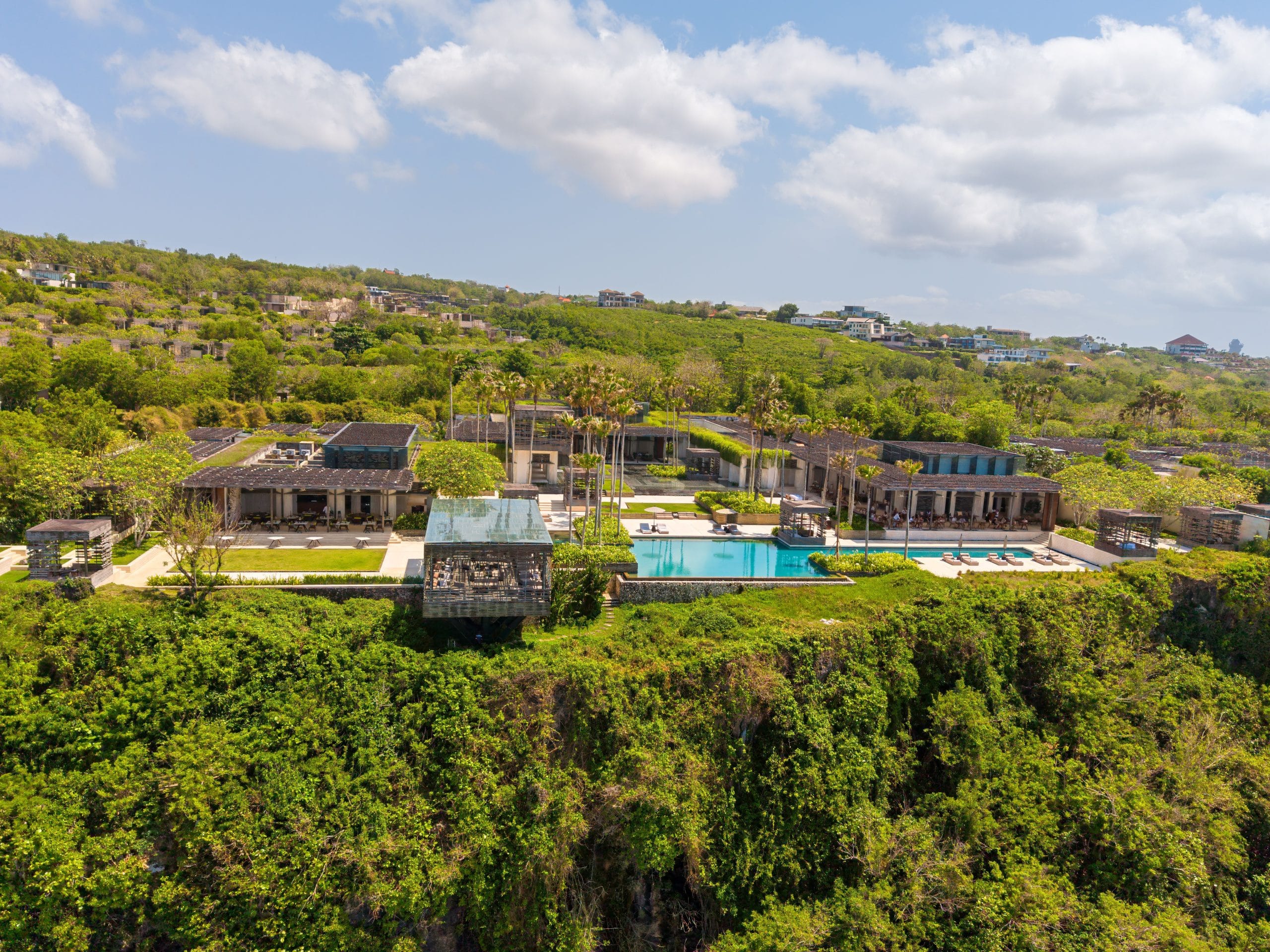 A serene view of luxury cliffside retreats overlooking the ocean