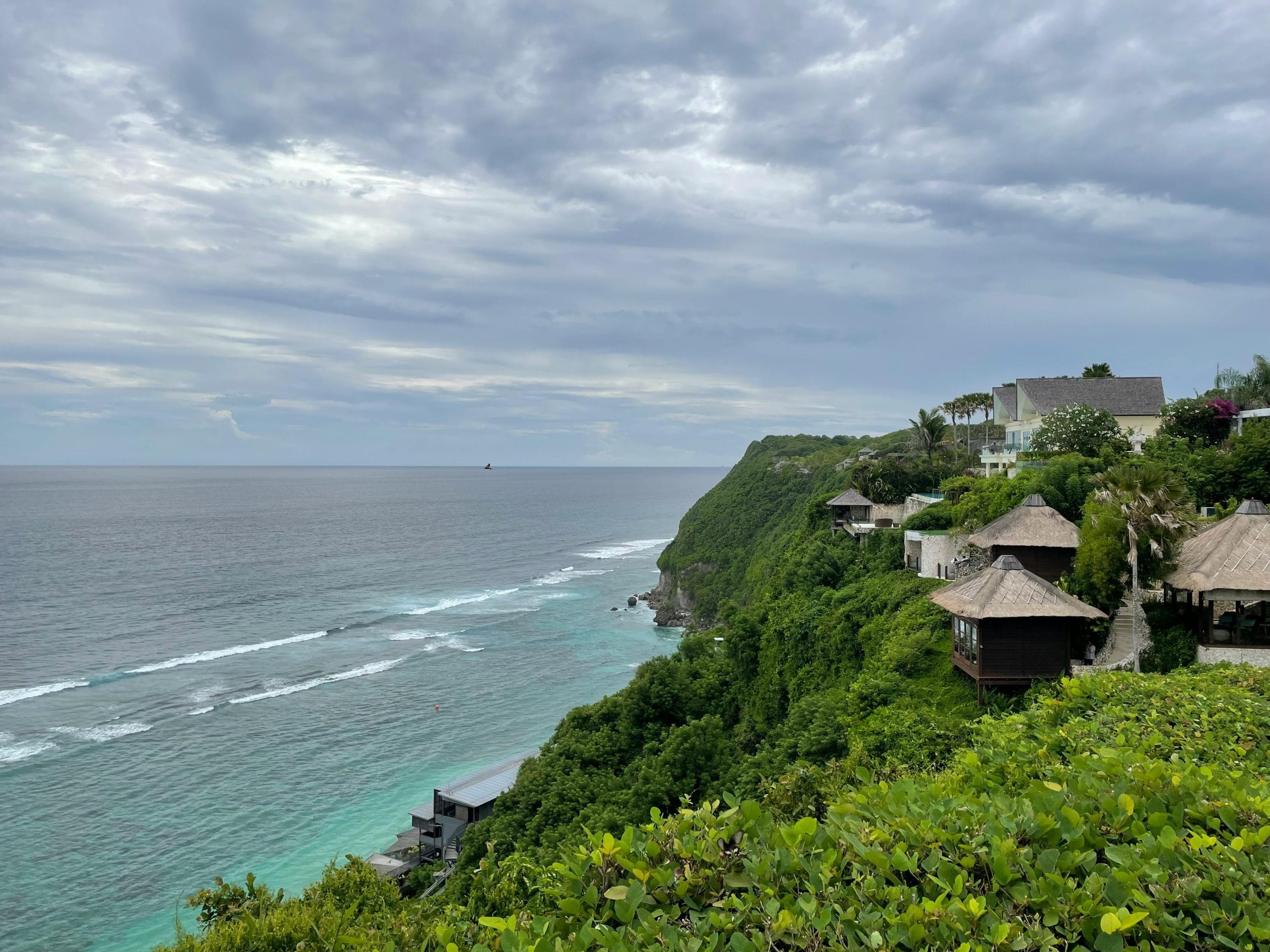 A serene view of luxury cliffside retreats overlooking the ocean