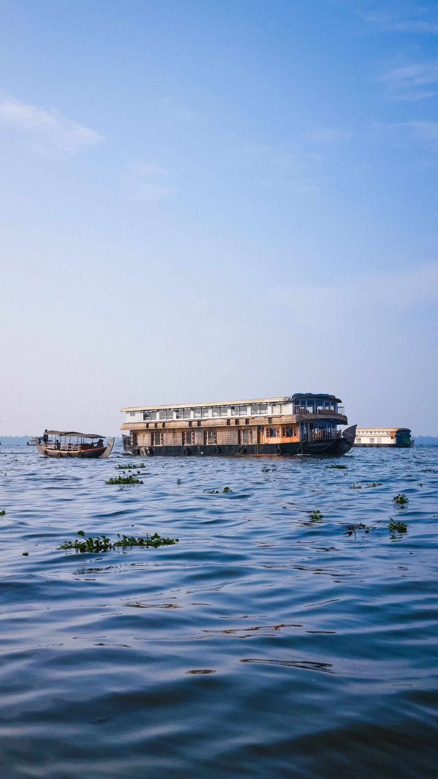 A serene luxury houseboat Kerala drifting through backwaters