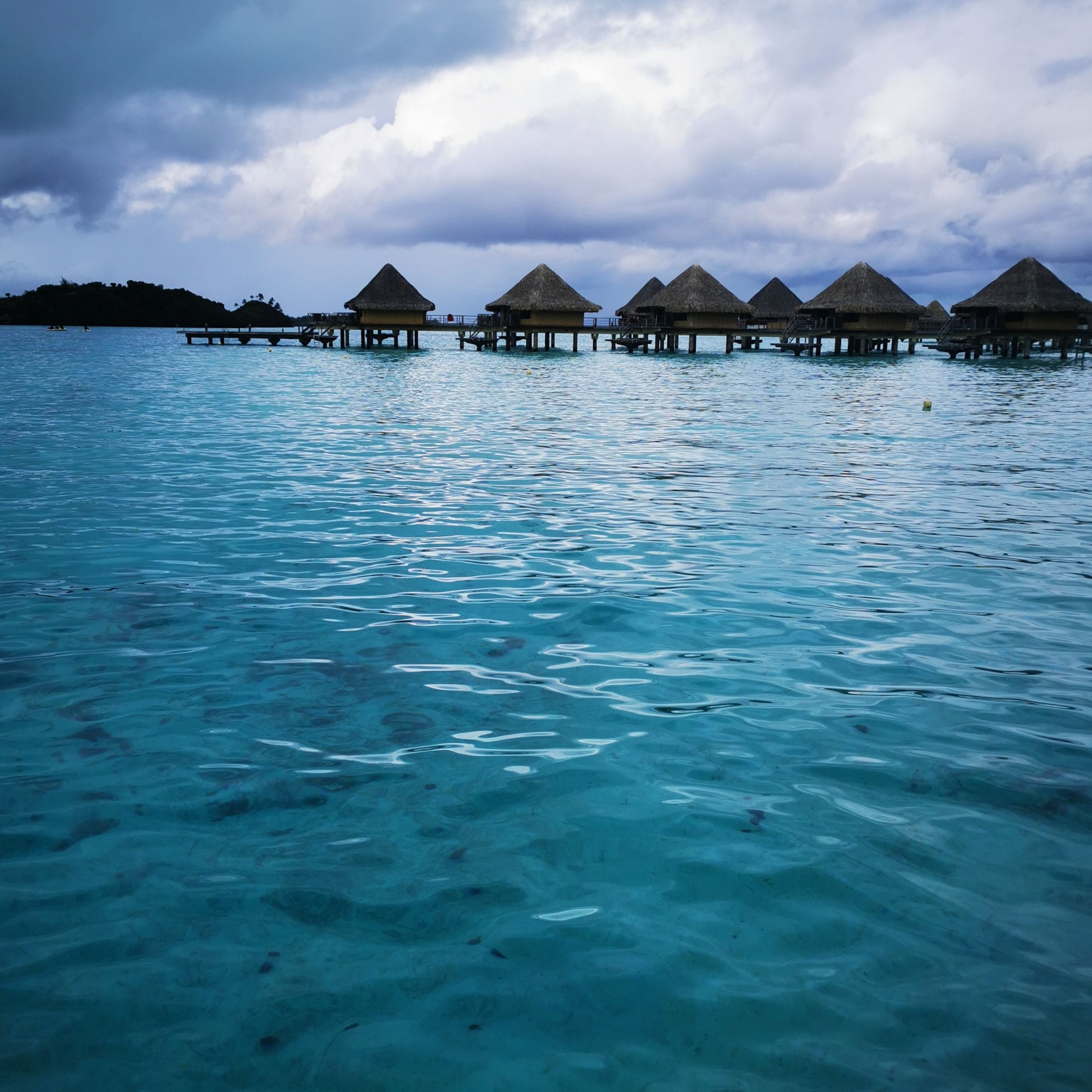 A serene view of luxury overwater villas Bora Bora in French Polynesia