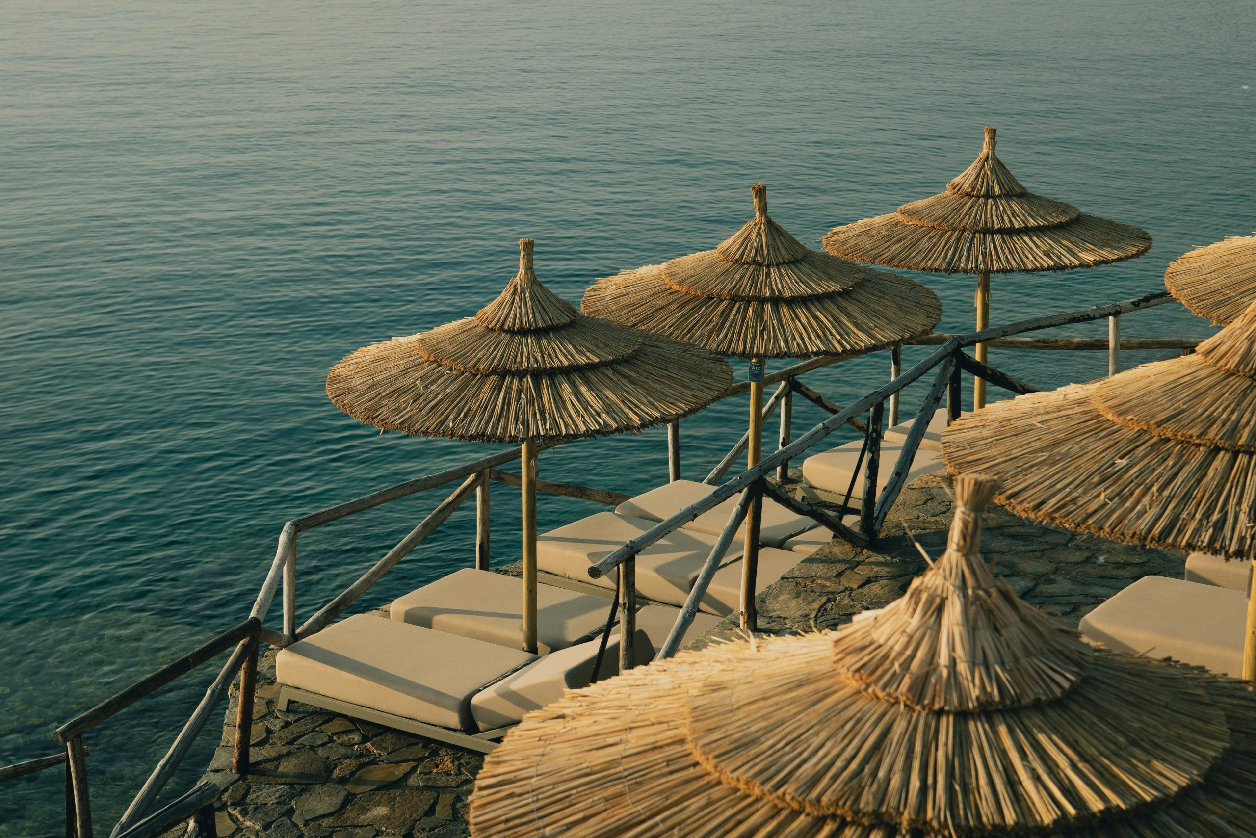 The Essence of Luxury Slow Travel in Sun-Washed Escapes A serene sun-washed terrace representing the mood of luxury slow travel