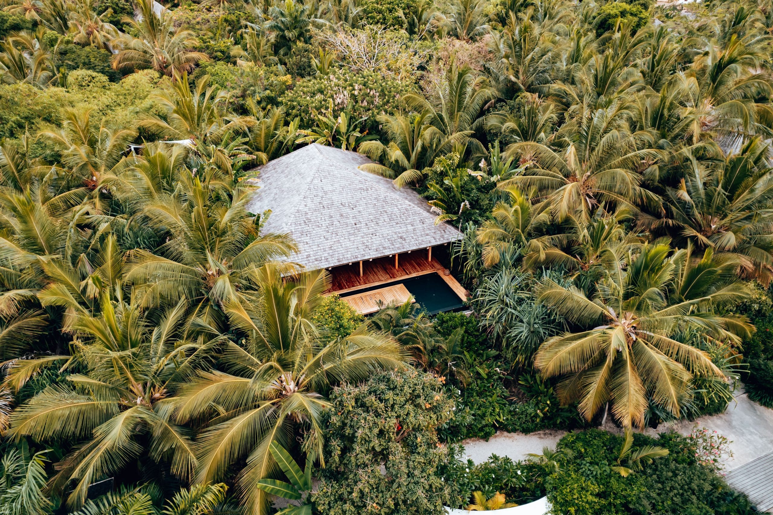 Discovering the Art of Secluded Luxury Island Getaways A serene aerial view of secluded luxury island getaways with turquoise water