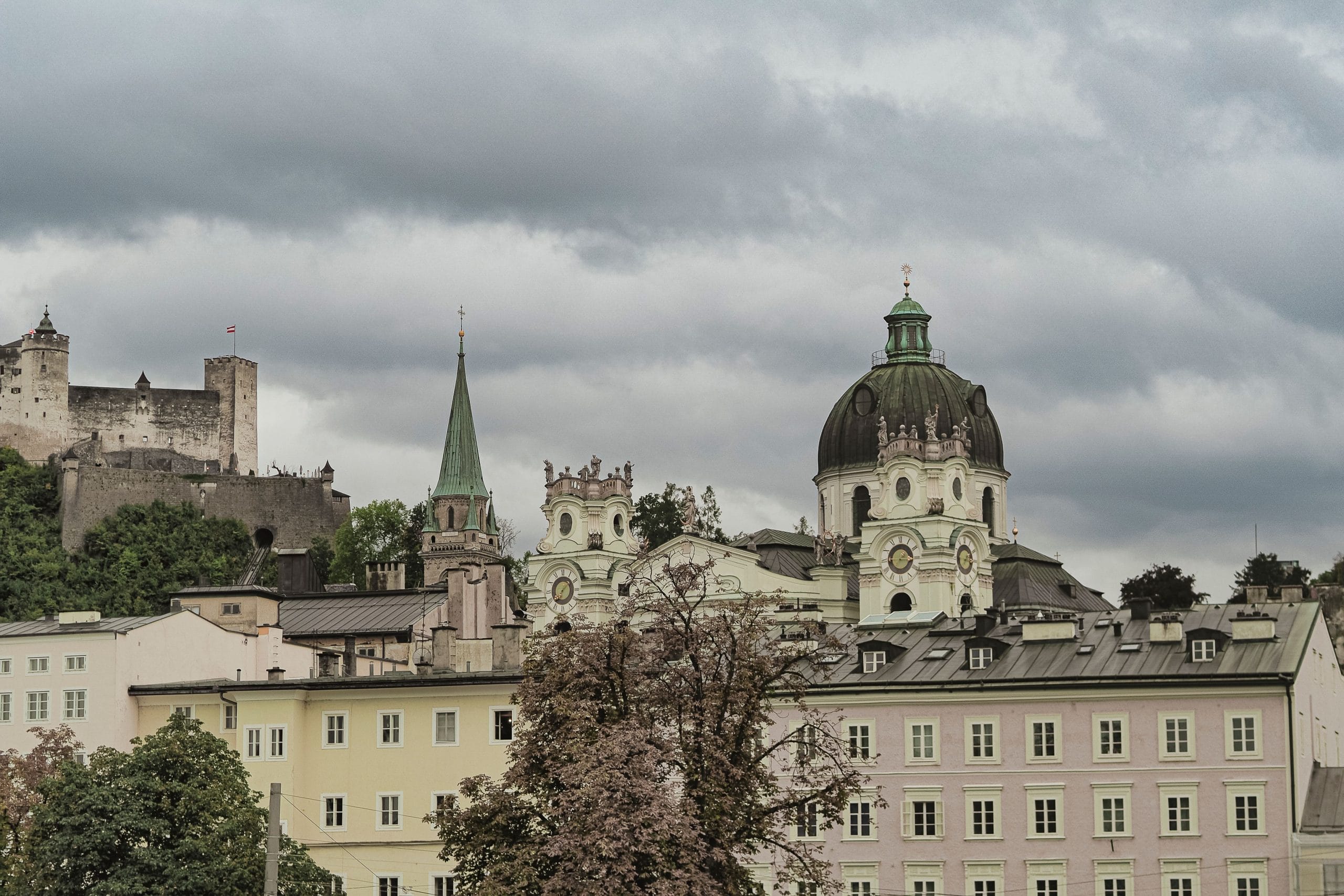 The Timeless Charm of Salzburg Luxury Boutique Stays A quiet street in Old Town Salzburg featuring luxury boutique stays and Baroque architecture