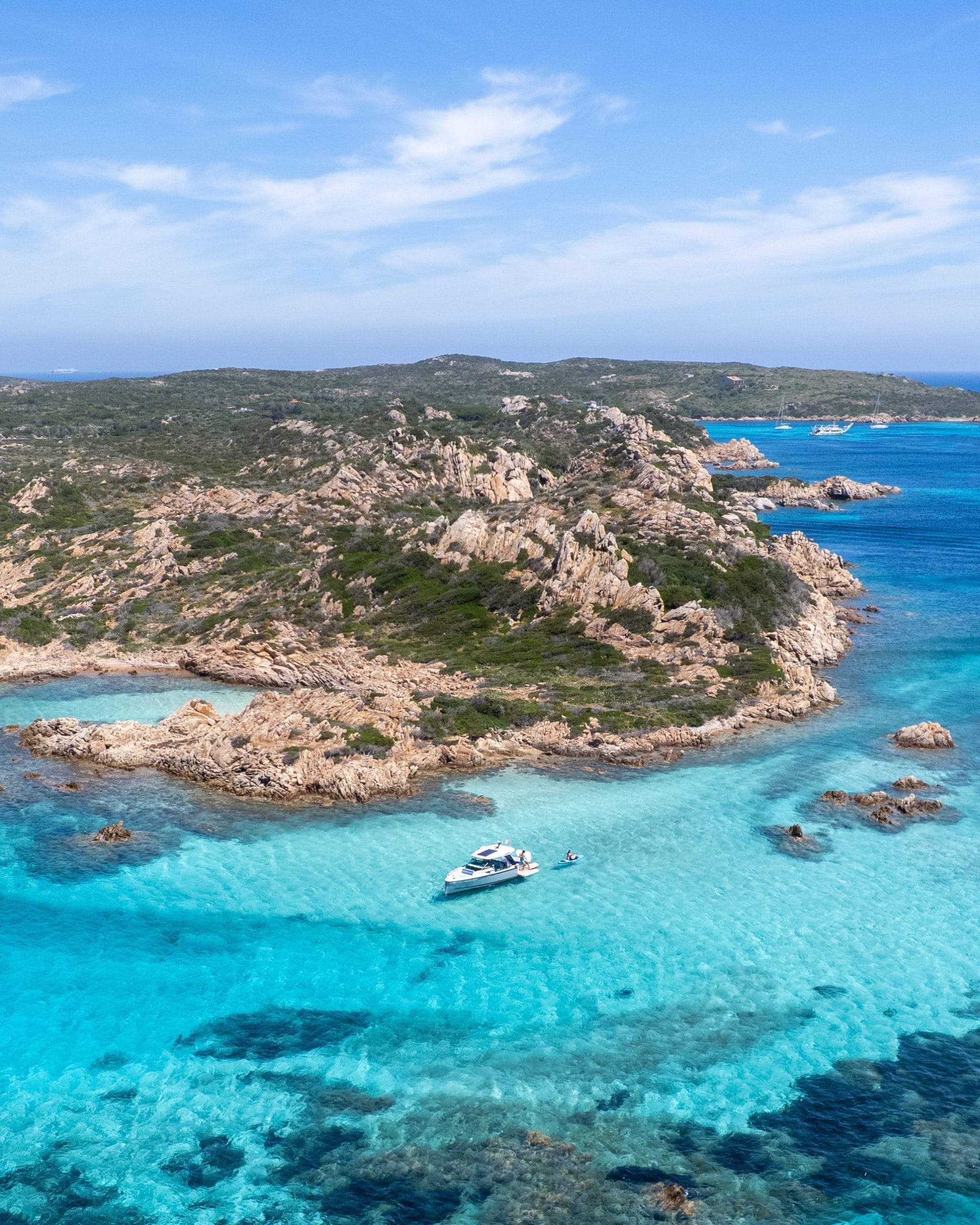 A serene view of Sardinia luxury beachfront retreats at sunset