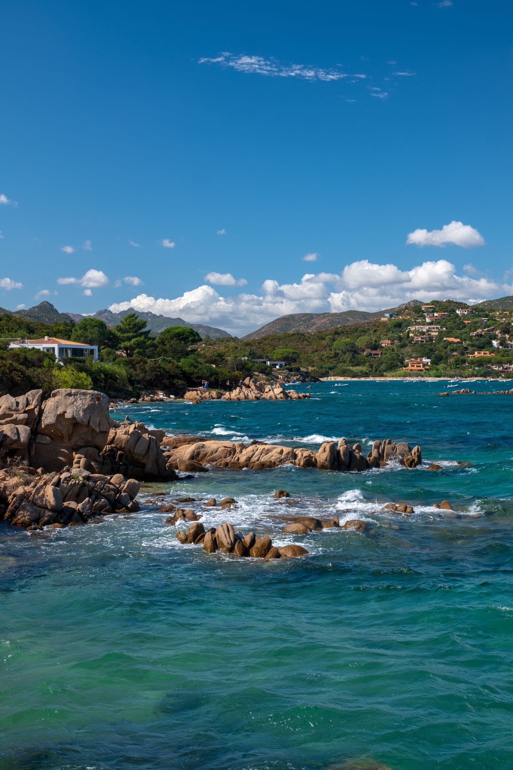 A serene view of Sardinia luxury beachfront retreats at sunset