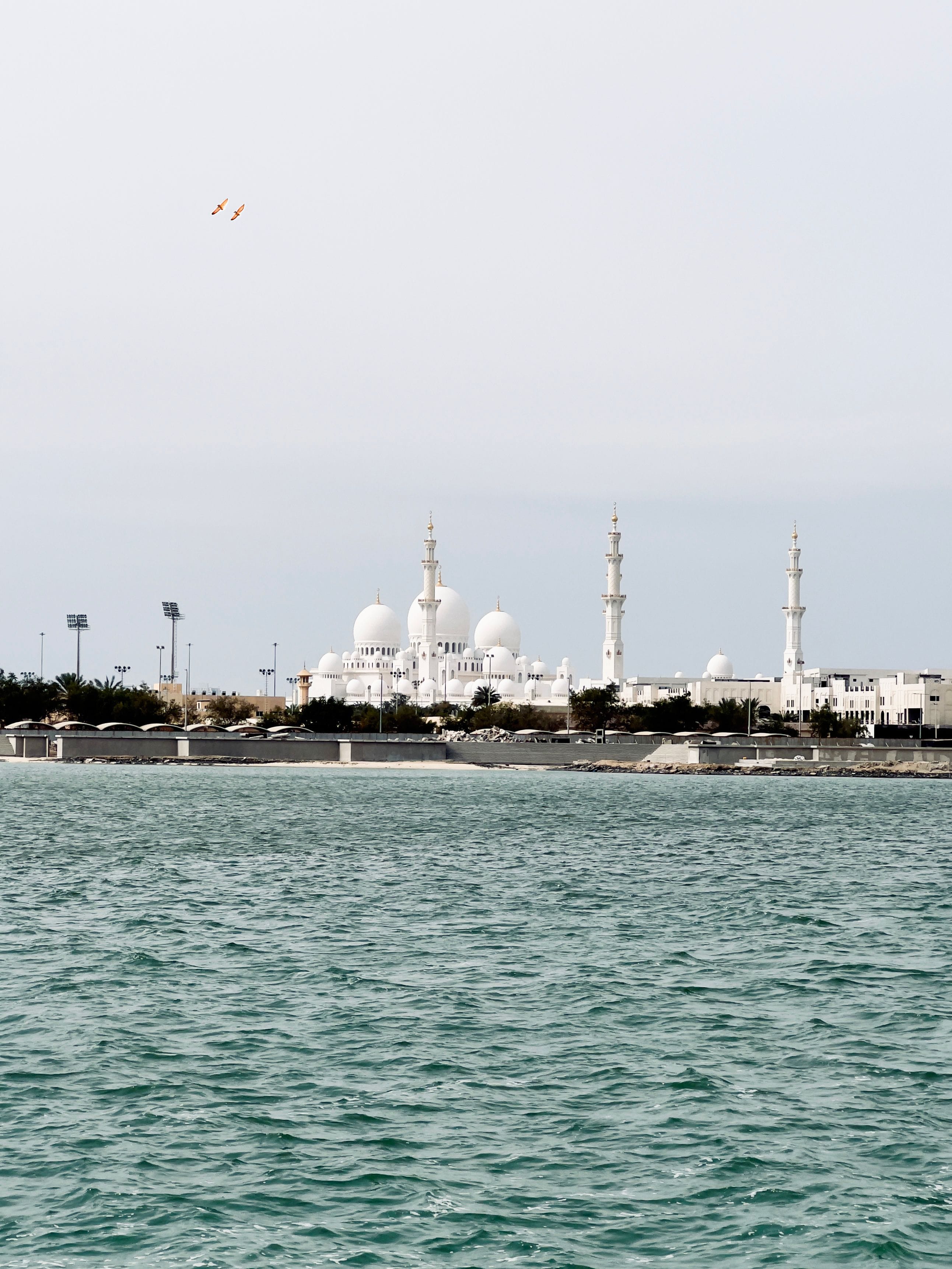A serene view of Abu Dhabi desert luxury resorts during sunrise