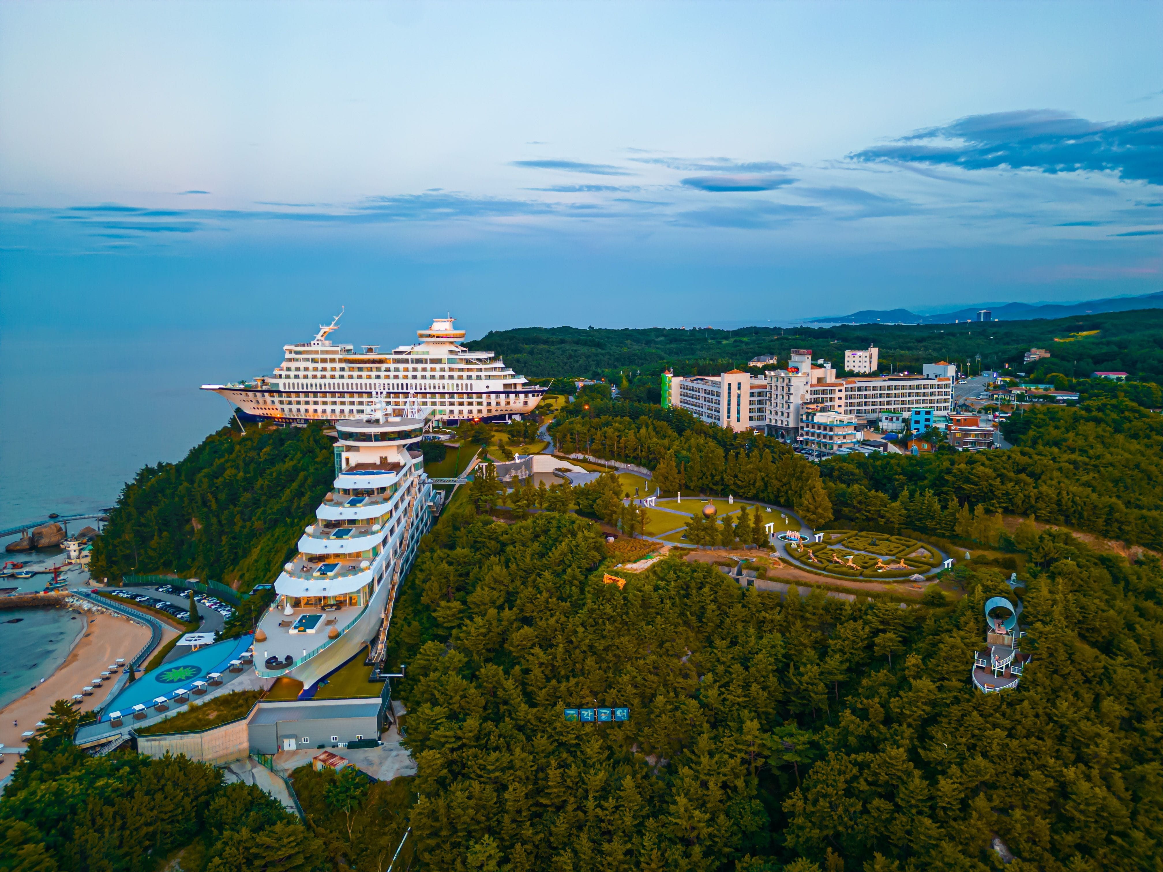 Serene luxury autumn retreats South Korea with traditional architecture and red maple leaves