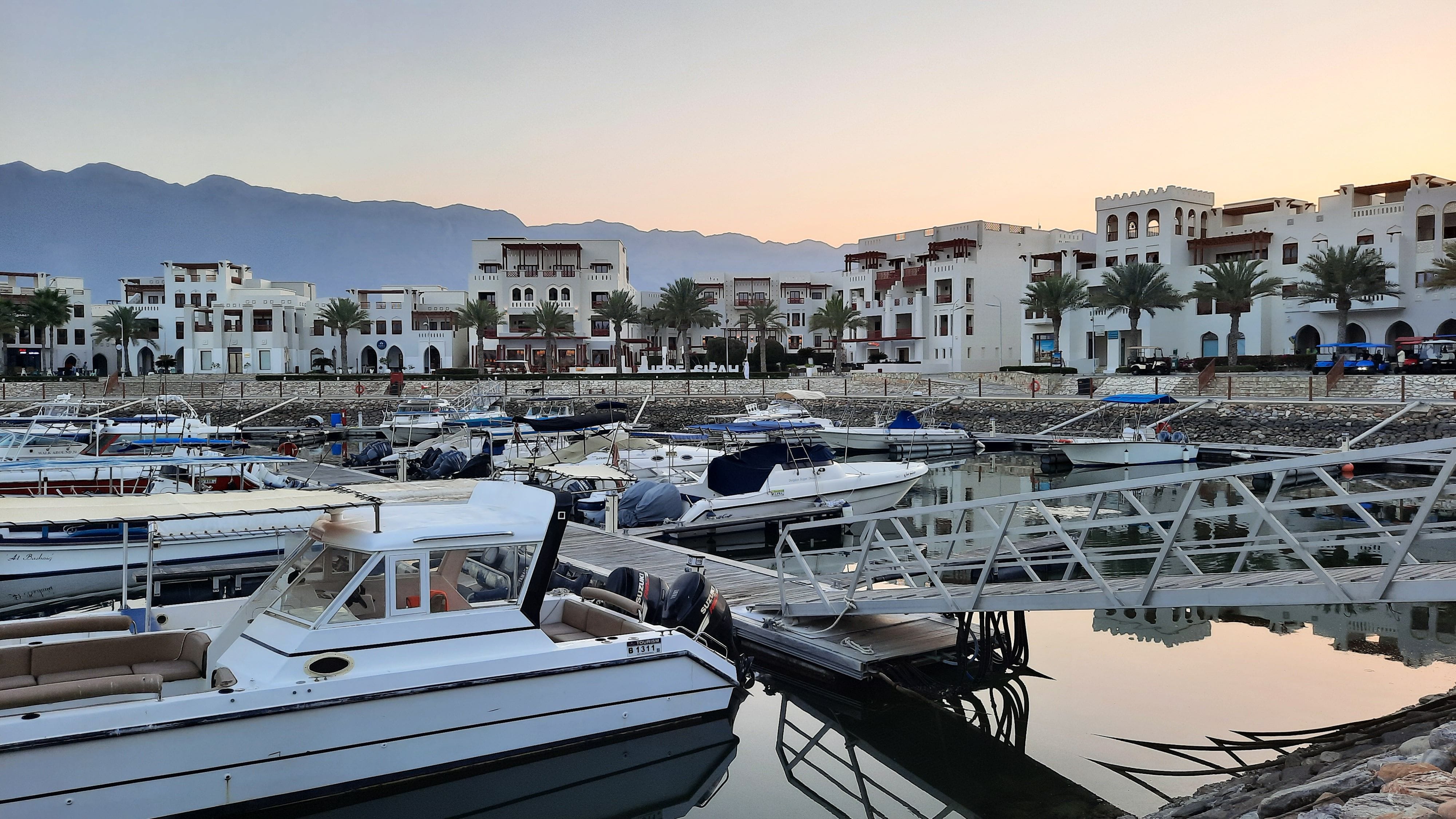 A serene view of Oman luxury mountain retreats at sunset