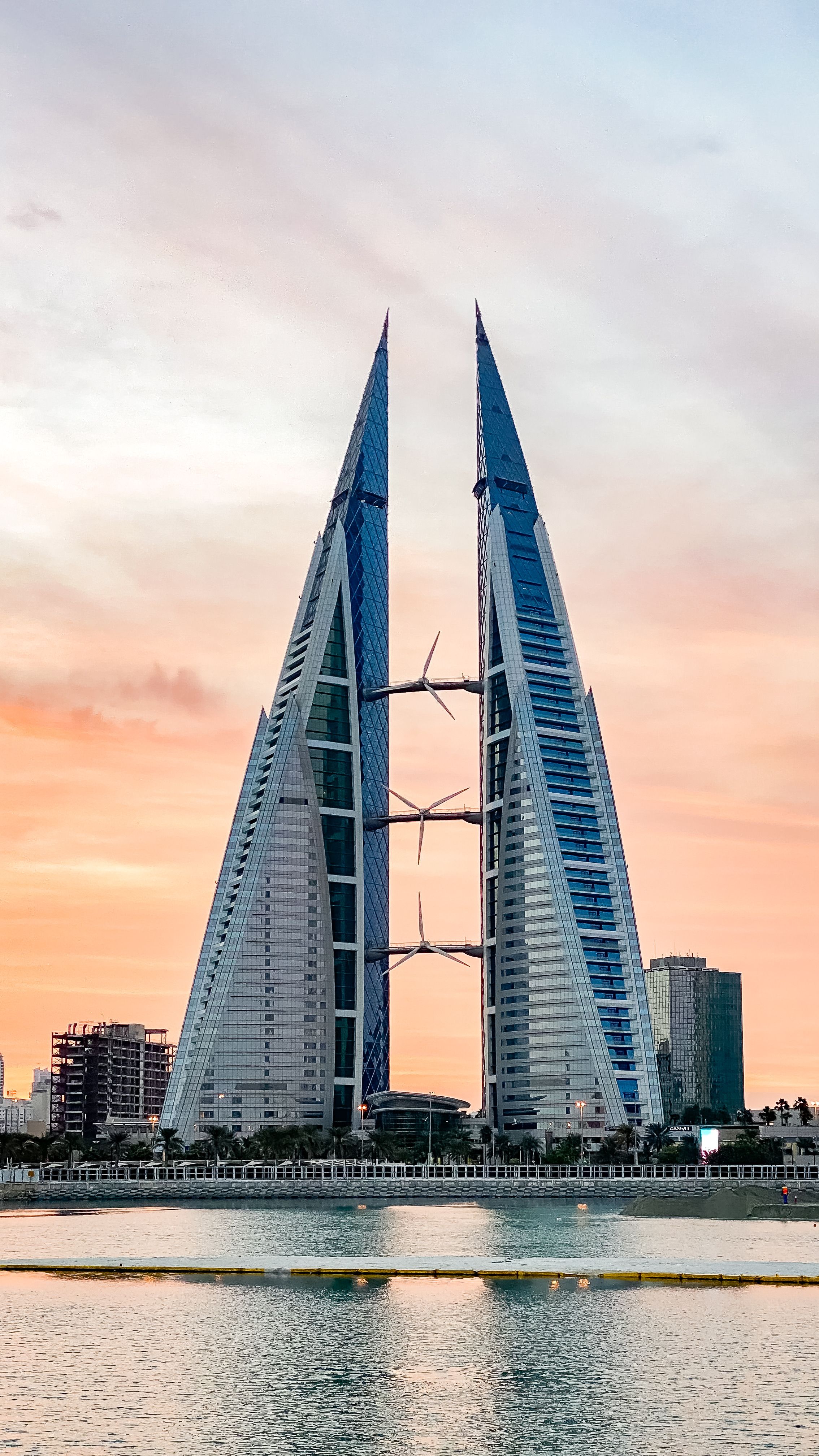 An elegant view of Manama coastal luxury stays during golden hour in Bahrain