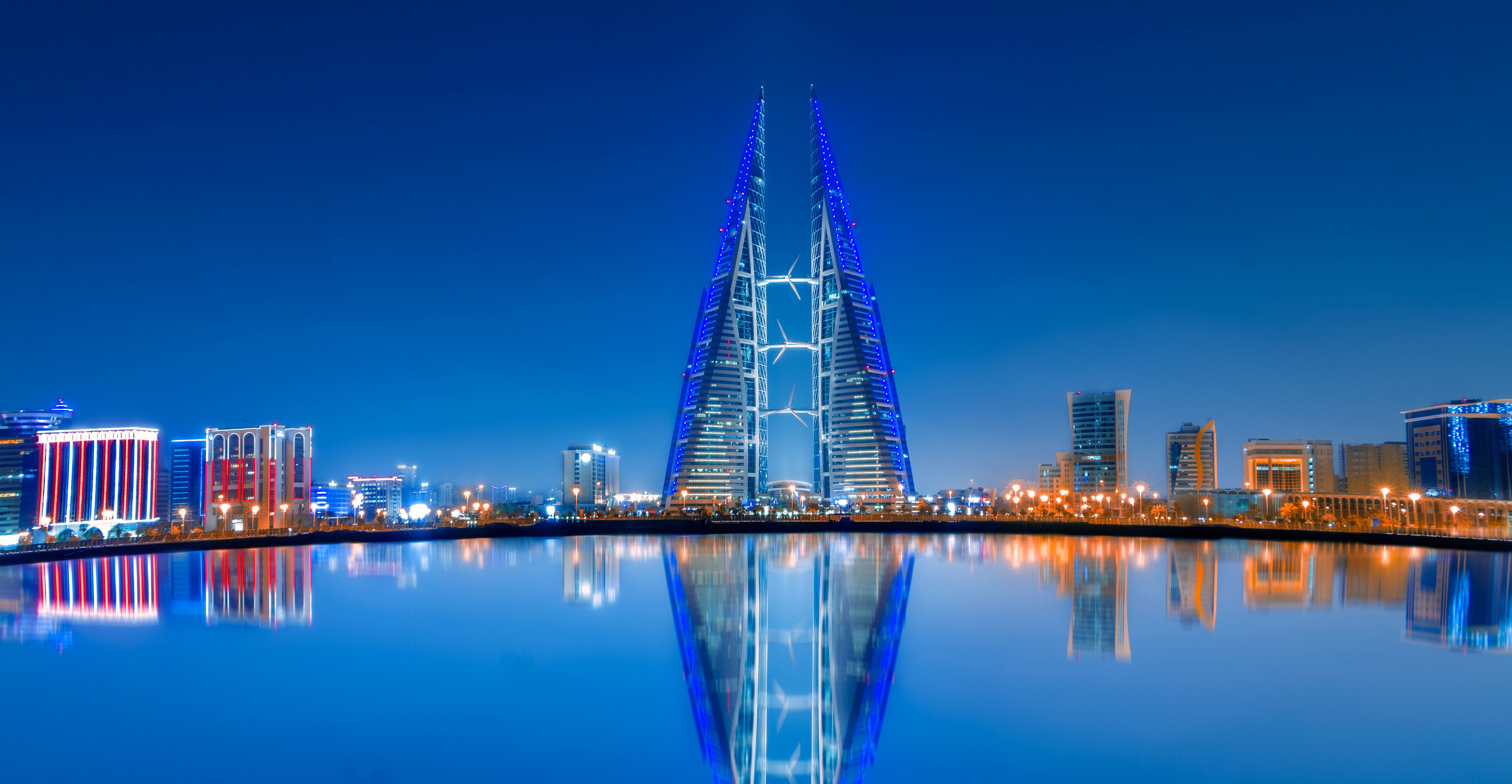 An elegant view of Manama coastal luxury stays during golden hour in Bahrain