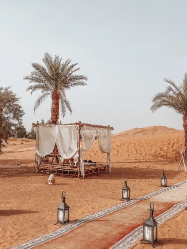 A serene view of luxury Sahara Desert escapes at sunset
